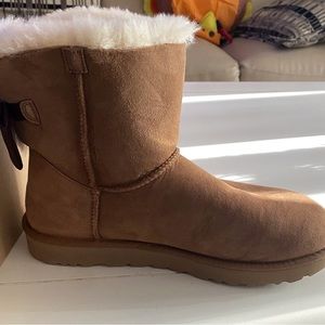 Brand new. UGGs Size 11 W Mini Safety Bow II Glam